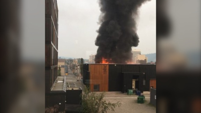 Flames are seen in downtown Prince George, B.C., after an explosion eruprted on Aug. 22, 2023. (Twitter/Chris Down) 